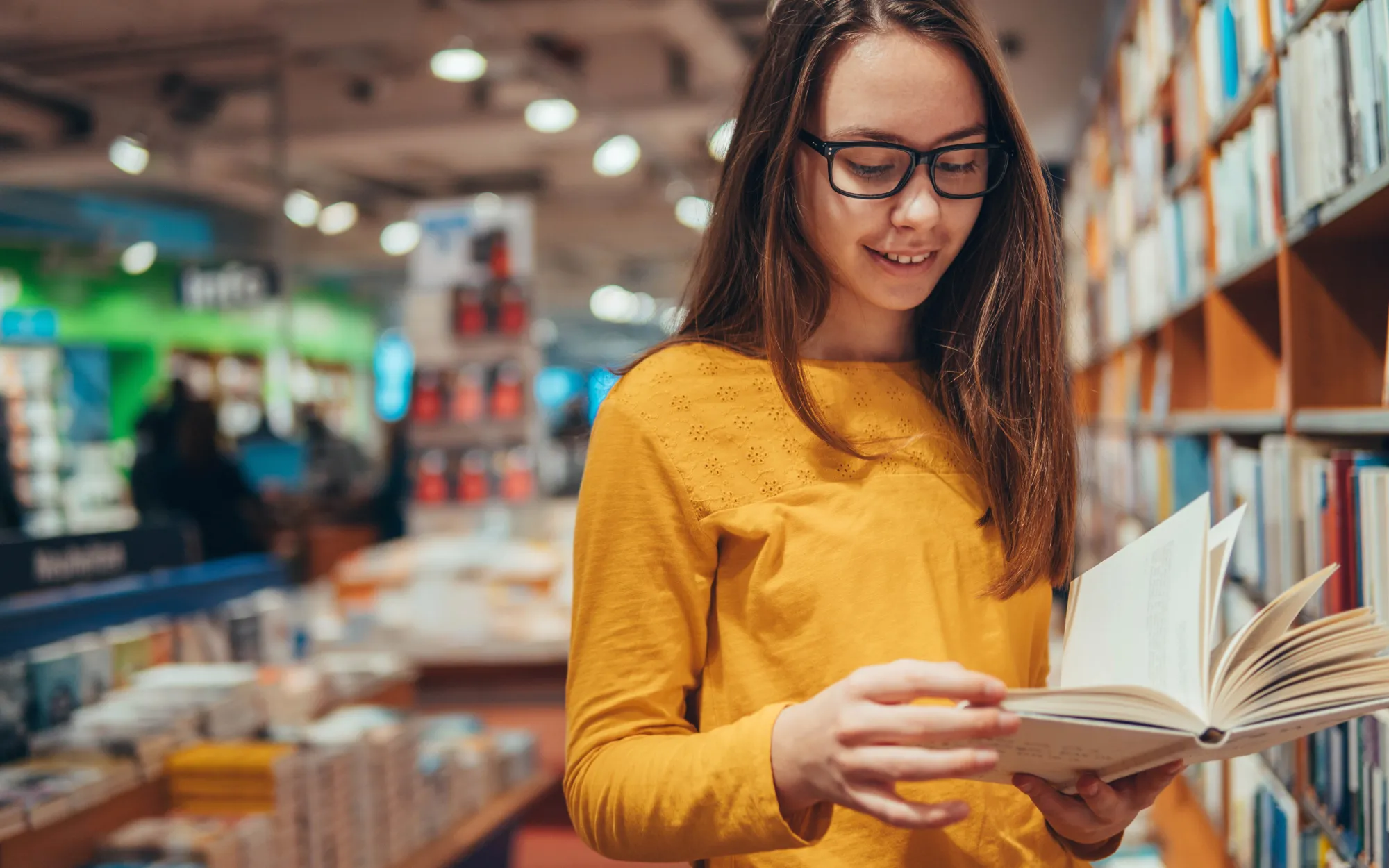 Woman standing reading a book