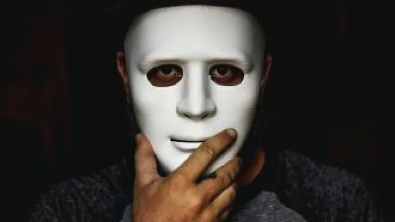 Person holding mask